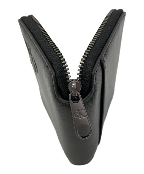 Calvin Klein（カルバンクライン）Calvin Klein (カルバンクライン) ラウンドジップウォレット ブラックの古着・服飾アイテム