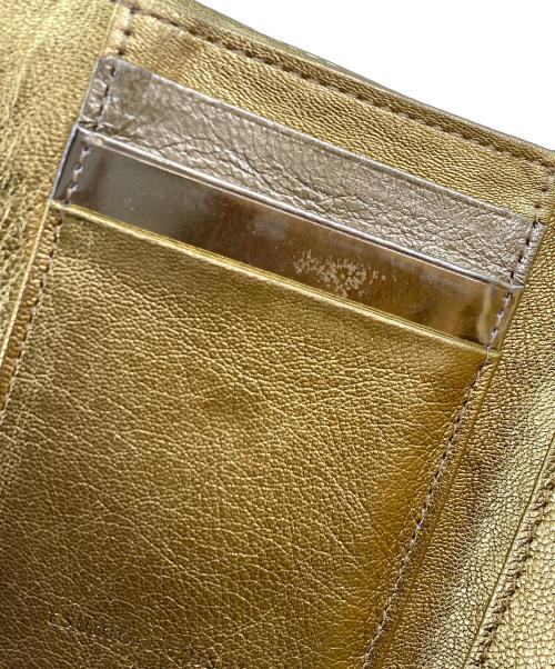 tsumori chisato carry（ツモリチサトキャリー）tsumori chisato CARRY (ツモリチサトキャリー) 3つ折り財布 ゴールドの古着・服飾アイテム