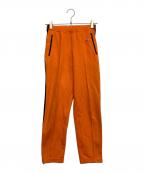 adidasアディダス）の古着「トラックパンツ」｜オレンジ