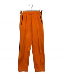 adidas（アディダス）の古着「トラックパンツ」｜オレンジ