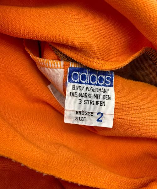 adidas（アディダス）adidas (アディダス) トラックパンツ オレンジ サイズ:2の古着・服飾アイテム