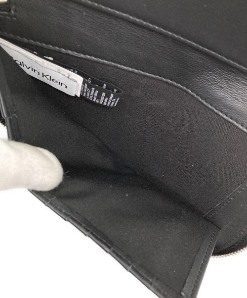 Calvin Klein（カルバンクライン）Calvin Klein (カルバンクライン) ラウンドジップウォレット ブラックの古着・服飾アイテム