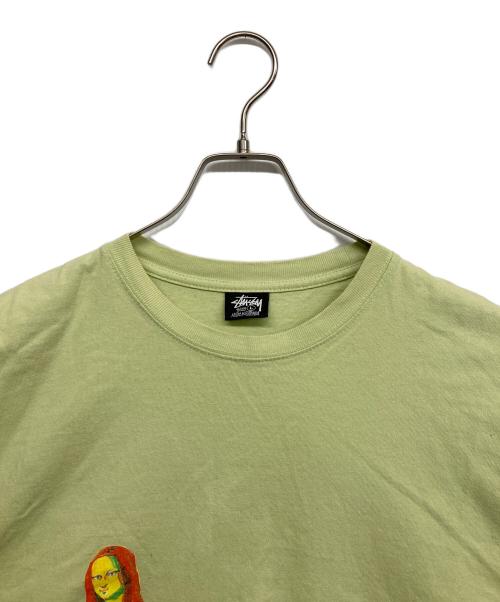 stussy（ステューシー）stussy (ステューシー) モナリザプリントロングカットソー 黄緑 サイズ:Lの古着・服飾アイテム