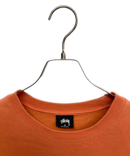 stussy（ステューシー）stussy (ステューシー) ストックロゴクルーネックスウェット オレンジ サイズ:Mの古着・服飾アイテム