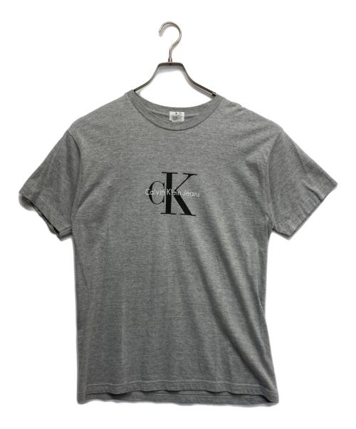 Calvin Klein Jeans（カルバンクラインジーンズ）Calvin Klein Jeans (カルバンクラインジーンズ) ロゴTシャツ グレー サイズ:Mの古着・服飾アイテム