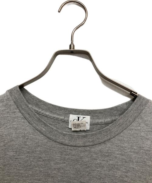 Calvin Klein Jeans（カルバンクラインジーンズ）Calvin Klein Jeans (カルバンクラインジーンズ) ロゴTシャツ グレー サイズ:Mの古着・服飾アイテム