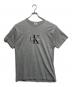 Calvin Klein Jeans（カルバンクラインジーンズ）の古着「ロゴTシャツ」｜グレー