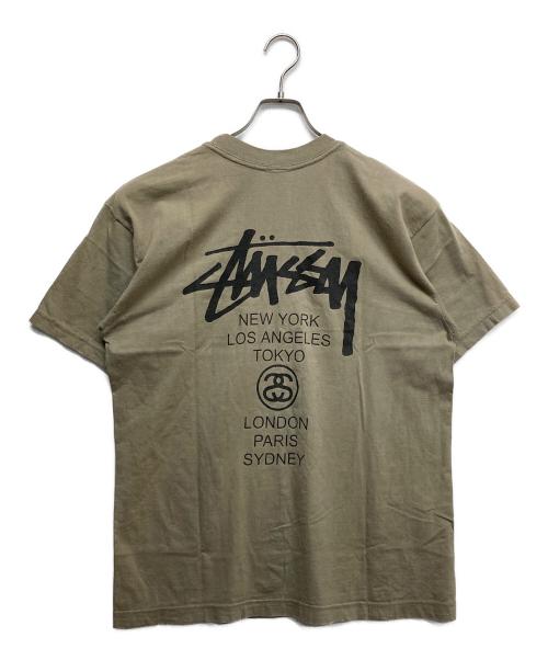 stussy（ステューシー）stussy (ステューシー) WORLD TOUR プリントTシャツ ベージュ サイズ:Lの古着・服飾アイテム