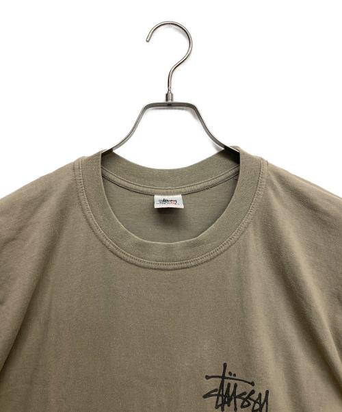 stussy（ステューシー）stussy (ステューシー) WORLD TOUR プリントTシャツ ベージュ サイズ:Lの古着・服飾アイテム