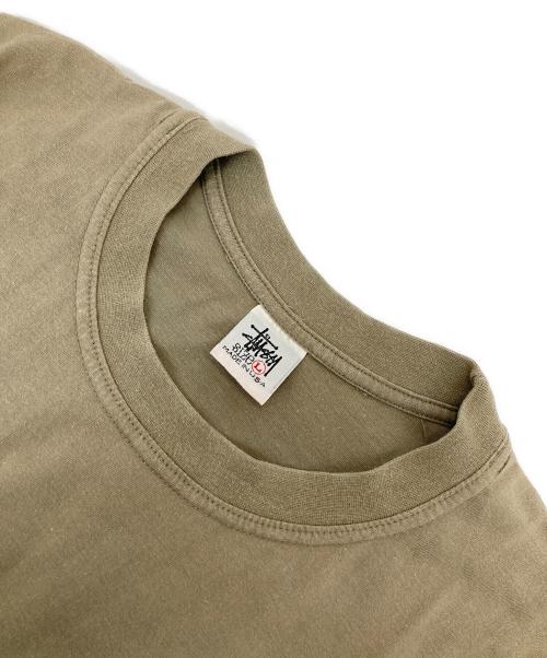 stussy（ステューシー）stussy (ステューシー) WORLD TOUR プリントTシャツ ベージュ サイズ:Lの古着・服飾アイテム