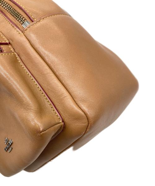 COACH（コーチ）COACH (コーチ) Disney (ディズニー) ディズニーコラボミニリュック ブラウンの古着・服飾アイテム
