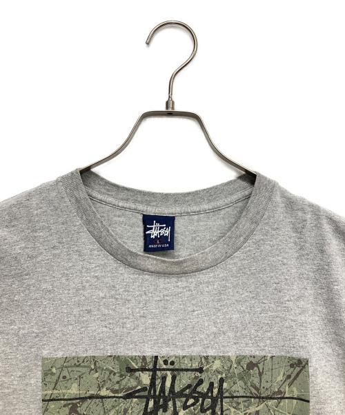 stussy（ステューシー）stussy (ステューシー) プリントTシャツ ライトグレー サイズ:Lの古着・服飾アイテム