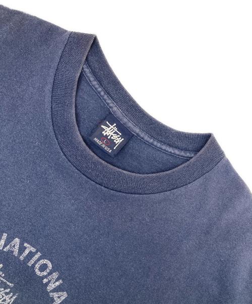 stussy（ステューシー）stussy (ステューシー) スカルインターナショナルプリントTシャツ ネイビー サイズ:Lの古着・服飾アイテム