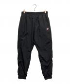 NIKEナイキ）の古着「WIND RUNNER WOVEN SIGN PANTS」｜ブラック