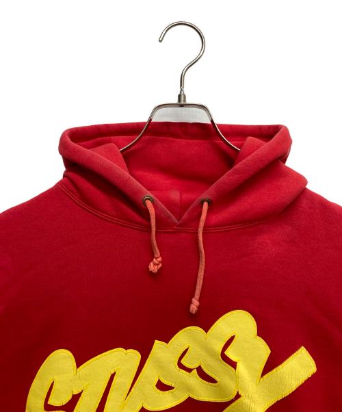 stussy（ステューシー）stussy (ステューシー) プリントプルオーバーパーカー レッド サイズ:Lの古着・服飾アイテム