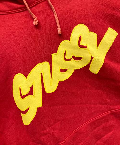 stussy（ステューシー）stussy (ステューシー) プリントプルオーバーパーカー レッド サイズ:Lの古着・服飾アイテム