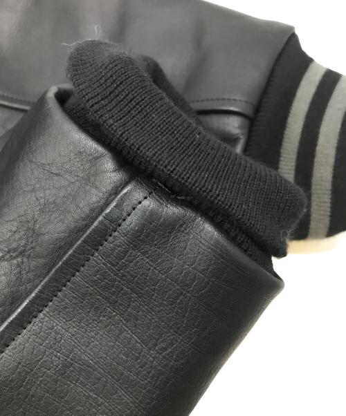 HUMAN MADE（ヒューマンメイド）HUMAN MADE (ヒューマンメイド) KAWS (カウズ) KAWS MADE VARSITY JACKET ブラック サイズ:XLの古着・服飾アイテム