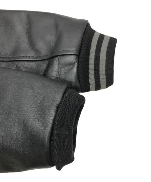 HUMAN MADE（ヒューマンメイド）HUMAN MADE (ヒューマンメイド) KAWS (カウズ) KAWS MADE VARSITY JACKET ブラック サイズ:XLの古着・服飾アイテム