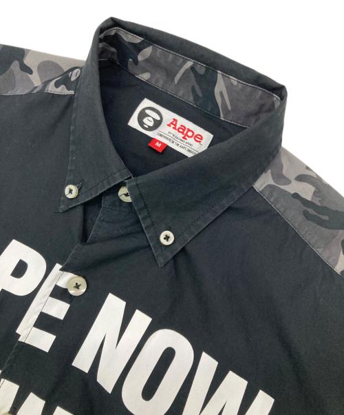 Aape BY A BATHING APE（エーエイプ バイ アベイシングエイプ）Aape BY A BATHING APE (エーエイプ バイ アベイシングエイプ) プリントシャツ ブラック サイズ:Mの古着・服飾アイテム