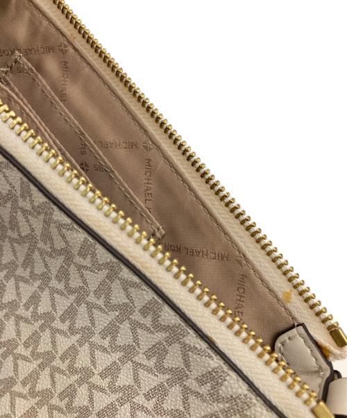 MICHAEL KORS（マイケル・コース）MICHAEL KORS (マイケル・コース) モノグラム 2way マルチポーチ スモール クロスボディバッグ ベージュの古着・服飾アイテム