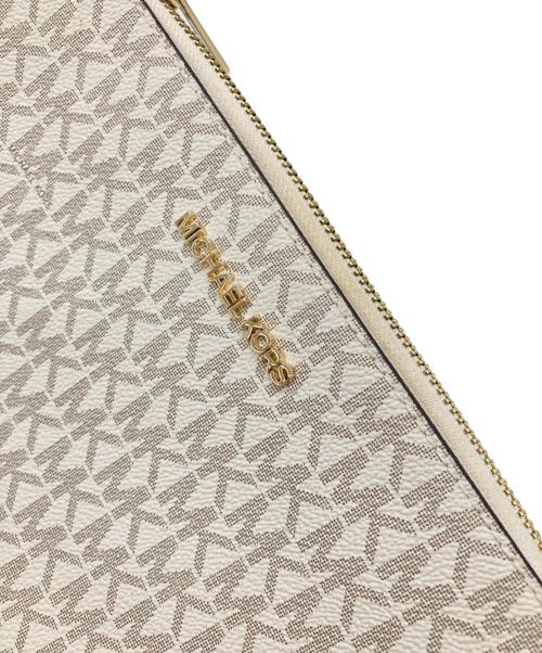 MICHAEL KORS（マイケル・コース）MICHAEL KORS (マイケル・コース) モノグラム 2way マルチポーチ スモール クロスボディバッグ ベージュの古着・服飾アイテム