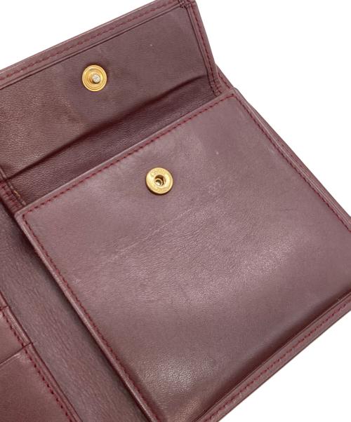Cartier（カルティエ）Cartier (カルティエ) マストライン2つ折り財布 ボルドーの古着・服飾アイテム