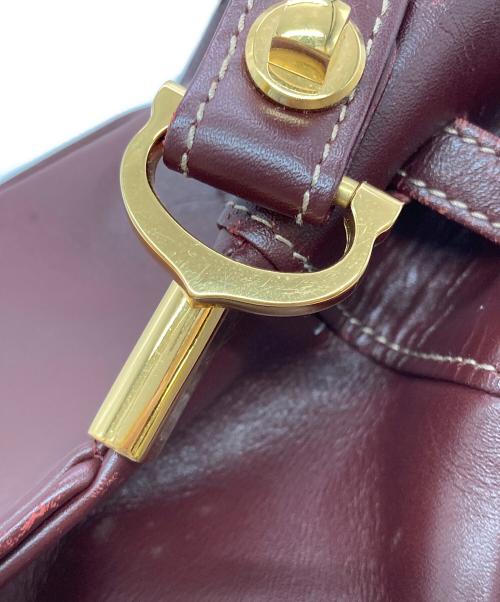 Cartier（カルティエ）Cartier (カルティエ) マストライン巾着ショルダーバッグ ボルドーの古着・服飾アイテム