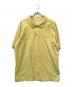 PRADA（プラダ）の古着「三角プレートポロシャツ」｜イエロー