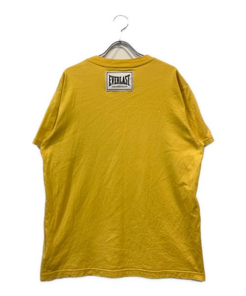 JOHN LAWRENCE SULLIVAN（ジョン ローレンス サリバン）JOHN LAWRENCE SULLIVAN (ジョン ローレンス サリバン) EVERLAST (エバーラスト) “HITMAN” t-shirt イエロー サイズ:Mの古着・服飾アイテム