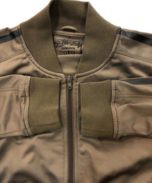 stussy（ステューシー）stussy (ステューシー) 00Sロゴプリントトラックブルゾン オリーブ サイズ:Mの古着・服飾アイテム