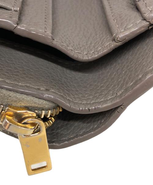 Saint Laurent Paris（サンローランパリ）Saint Laurent Paris (サンローランパリ) カサンドラロゴ 二つ折りウォレット グレーの古着・服飾アイテム