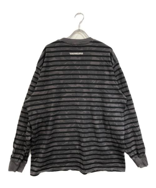 A BATHING APE（ア ベイシング エイプ）A BATHING APE (ア ベイシング エイプ) SOLID CAMO ONE POINT RELAXED FIT STRIPE LS TEE ブラック サイズ:SIZE Mの古着・服飾アイテム