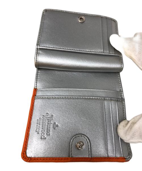 Vivienne Westwood（ヴィヴィアンウエストウッド）Vivienne Westwood (ヴィヴィアンウエストウッド) 2つ折り財布 オレンジの古着・服飾アイテム