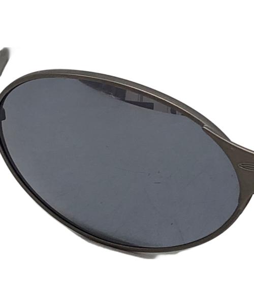 OAKLEY（オークリー）OAKLEY (オークリー) E-WIREオーバルサングラス グレーの古着・服飾アイテム
