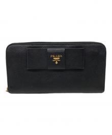 PRADA（プラダ）の古着「サフィアーノ リボン ラウンドジップウォレット」｜ブラック