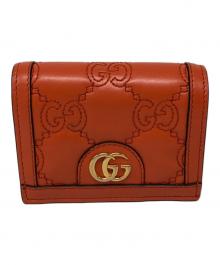 GUCCI（グッチ）の古着「GGマトラッセ コンパクト ウォレット」｜オレンジ
