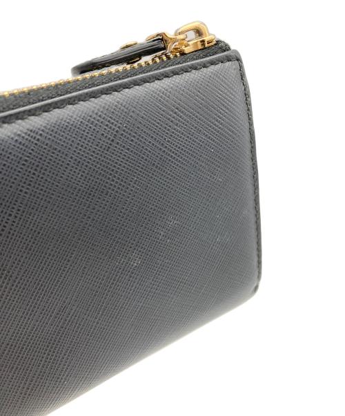 Salvatore Ferragamo（サルヴァトーレ フェラガモ）Salvatore Ferragamo (サルヴァトーレ フェラガモ) リボンL字ジップウォレット ネイビーの古着・服飾アイテム