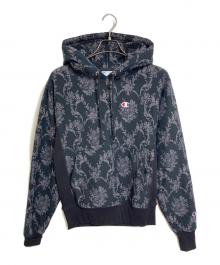 Champion（チャンピオン）の古着「総柄プルオーバーパーカー　裏起毛パーカー　目あり　リバースウィーブ　総柄」｜ブラック