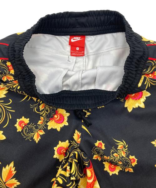 NIKE（ナイキ）NIKE (ナイキ) AS M NSW JGGR PK TRIBUTE AOP ジャガーパンツ トラックパンツ 花柄 ブラック×イエロー サイズ:Sの古着・服飾アイテム