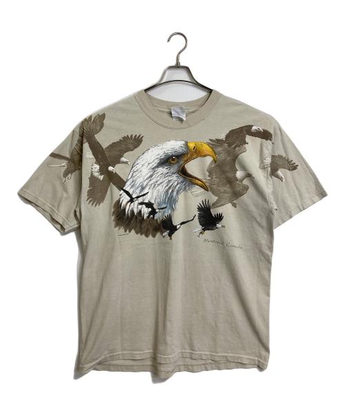 GILDAN（ギルダン）GILDAN (ギルダン) 【古着】90’S両面プリント Montreal Canada  1999 PETER KULL  半袖　Tシャツ　90年代　鳥 ベージュ サイズ:XLの古着・服飾アイテム
