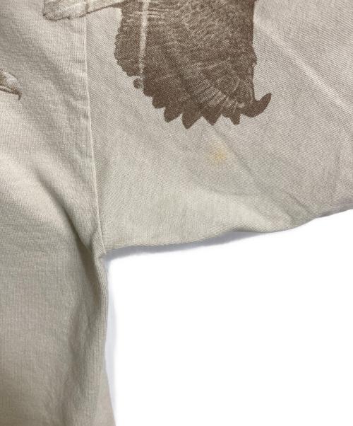 GILDAN（ギルダン）GILDAN (ギルダン) 【古着】90’S両面プリント Montreal Canada  1999 PETER KULL  半袖　Tシャツ　90年代　鳥 ベージュ サイズ:XLの古着・服飾アイテム
