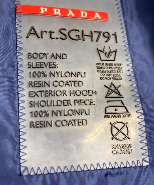 PRADA SPORTS（プラダスポーツ）PRADA SPORTS (プラダスポーツ) チェック切替ナイロンジャケット レッドバーロゴ サイドロゴ　アウター　ライトアウター　国内代理店表記あり ホワイト×ブルー サイズ:46の古着・服飾アイテム