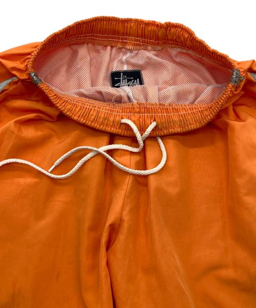 stussy sport（ステューシー スポーツ）stussy sport (ステューシー スポーツ) 【古着】ナイロンパンツ　ラインパンツ　 ジャージ　USA製 old stussy オレンジ サイズ:実寸参照の古着・服飾アイテム
