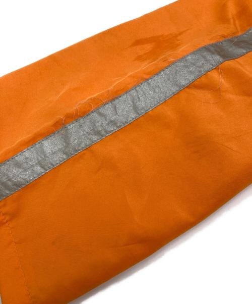 stussy sport（ステューシー スポーツ）stussy sport (ステューシー スポーツ) 【古着】ナイロンパンツ　ラインパンツ　 ジャージ　USA製 old stussy オレンジ サイズ:実寸参照の古着・服飾アイテム