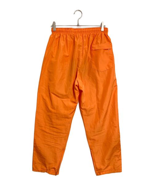 stussy sport（ステューシー スポーツ）stussy sport (ステューシー スポーツ) 【古着】ナイロンパンツ　ラインパンツ　 ジャージ　USA製 old stussy オレンジ サイズ:実寸参照の古着・服飾アイテム