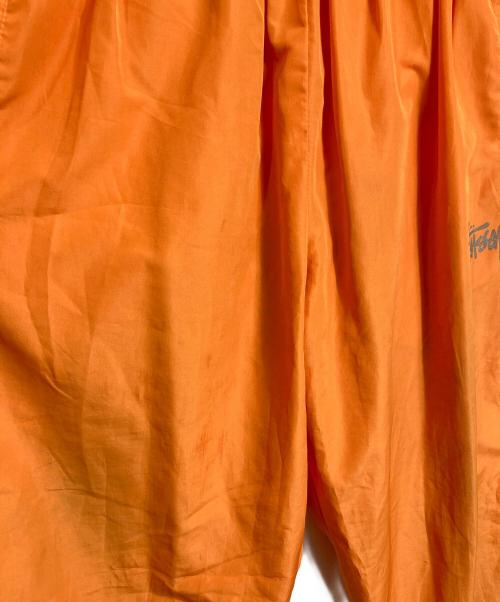 stussy sport（ステューシー スポーツ）stussy sport (ステューシー スポーツ) 【古着】ナイロンパンツ　ラインパンツ　 ジャージ　USA製 old stussy オレンジ サイズ:実寸参照の古着・服飾アイテム