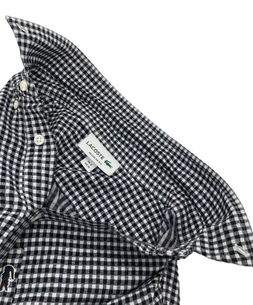 LACOSTE（ラコステ）LACOSTE (ラコステ) クールマックスブレンドジャガード半袖ポロシャツ　ギンガム ブラック×ホワイト サイズ:Mの古着・服飾アイテム