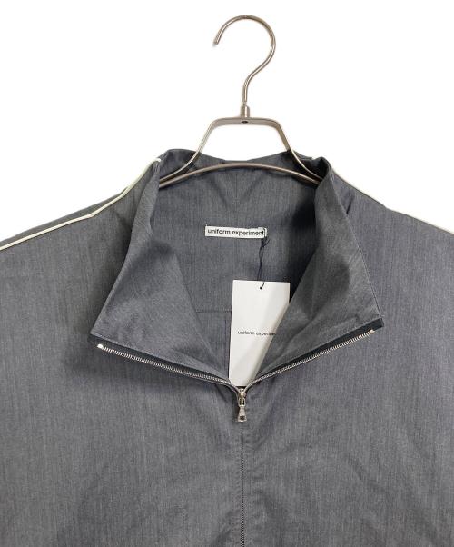 uniform experiment（ユニフォームエクスペリメント）uniform experiment REFINED PIPING TRACK JACKET  パイピングトラックジャケット　トラックジャケット　アウター　ライトアウター　ダブルジップ　日本製 グレー サイズ:2の古着・服飾アイテム