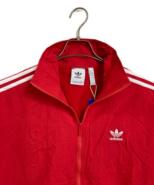 adidas（アディダス）adidas (アディダス) アディカラー ウーブン ファイヤーバード トラックトップ　アウター　ライトアウター　スポーツ　アウトドア レッド サイズ:L 未使用品の古着・服飾アイテム