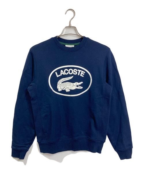 LACOSTE（ラコステ）LACOSTE (ラコステ) フロッキーオーバルクロッククルーネックスウェット　ダカワニフロッキースウェット　 ネイビー サイズ:US Sの古着・服飾アイテム